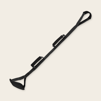Triple Grip Leg Lifter in black: a 110 cm strap with a top hand loop, two padded side grips and a padded foot loop.
