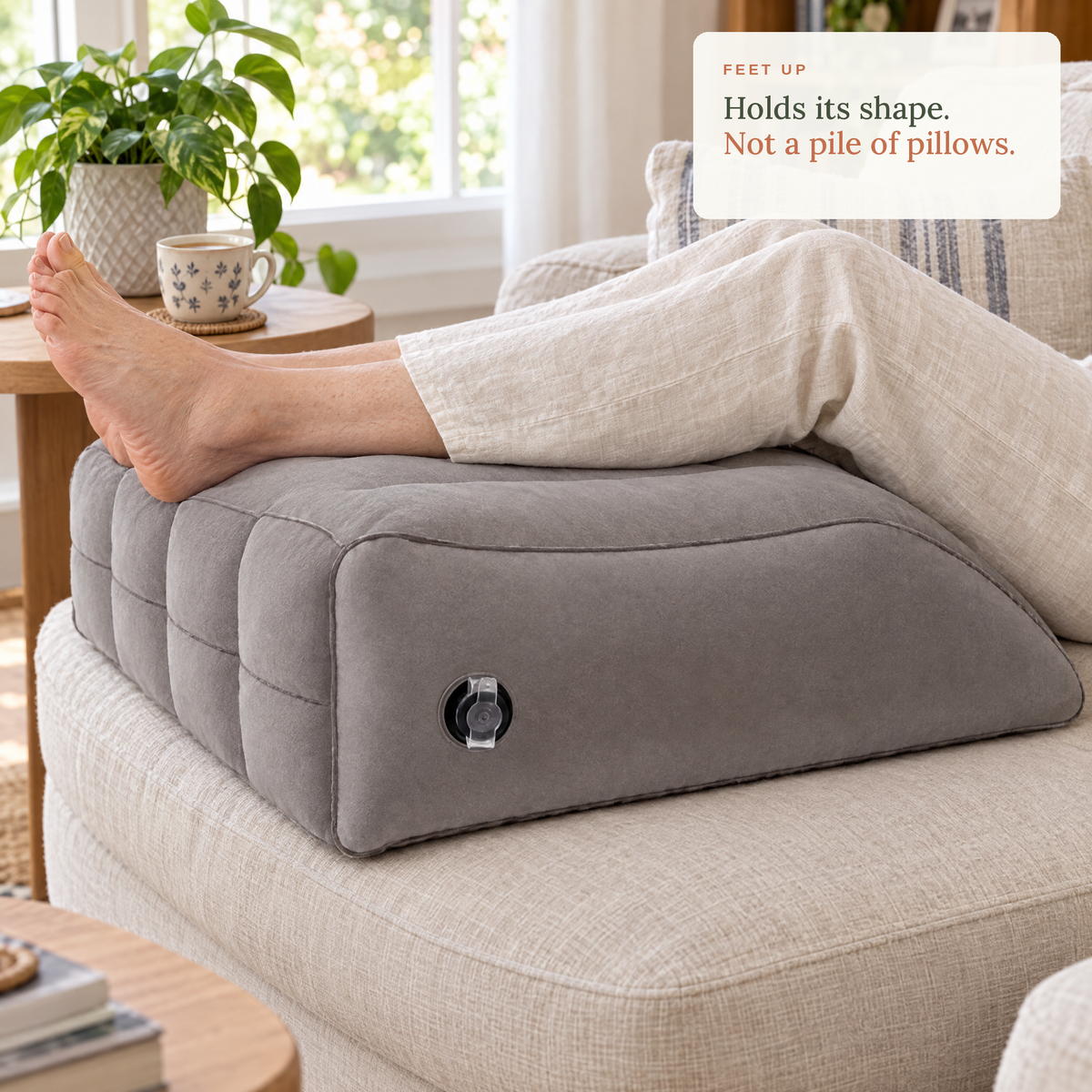 Feet up on the inflatable leg wedge on a linen sofa. Holds its shape, not a pile of pillows.