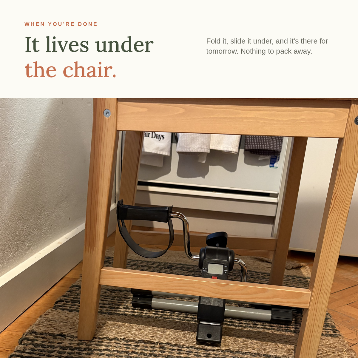 Folded mini exercise pedals stored under a wooden dining chair