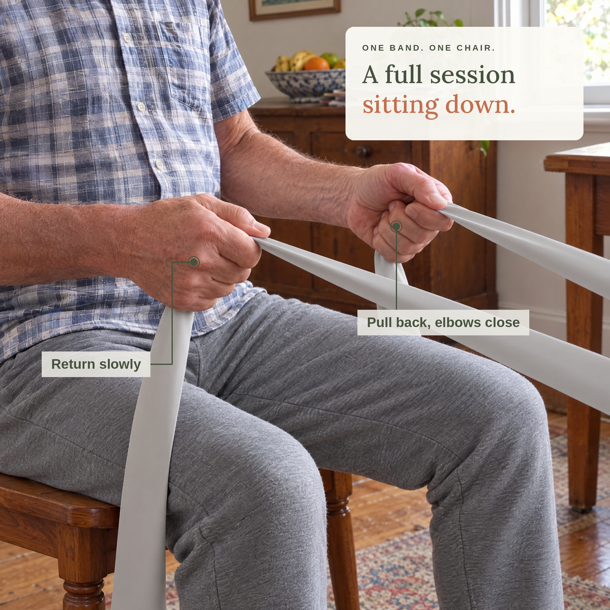 A full session sitting down. An older man doing a seated row with the long resistance band.