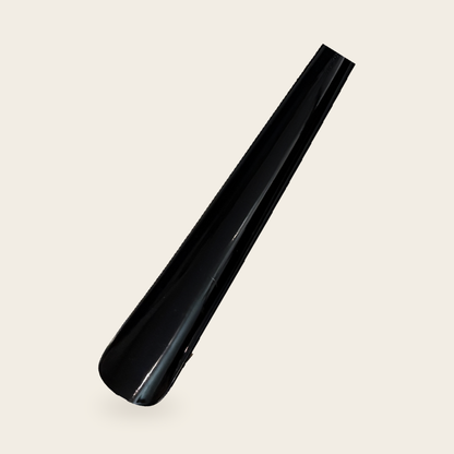 Close-up of the broad rounded scoop on the long reach shoe horn