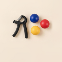 Adjustable hand gripper and soft grip strength balls in blue, red and yellow on a cream background