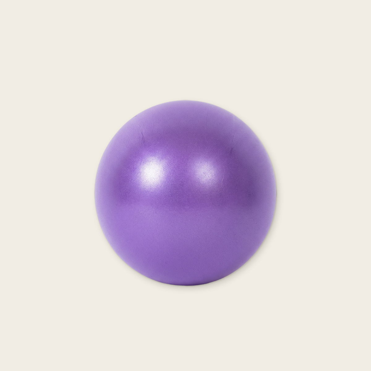 Purple mini exercise ball, about 23 cm across, on a cream background