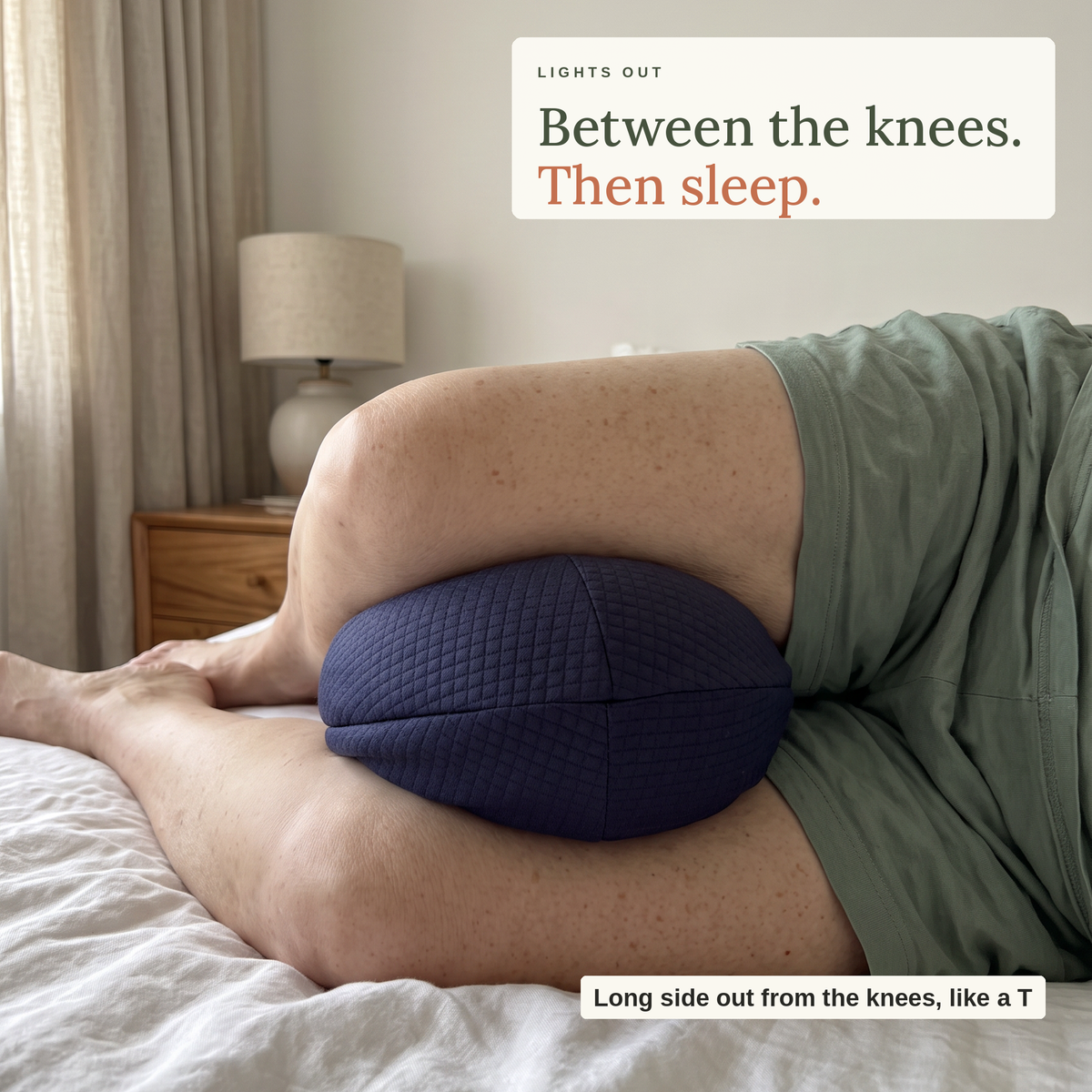 Bean Knee Pillow between the knees of a woman lying on her side, long side pointing out like a T
