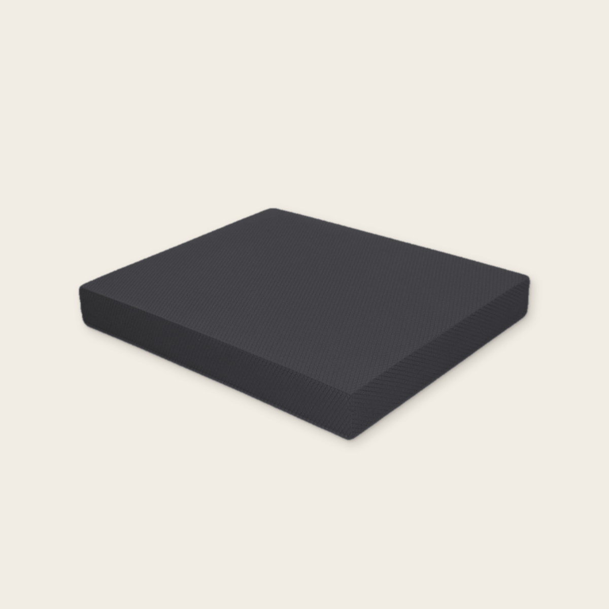 Black balance pad on a cream background