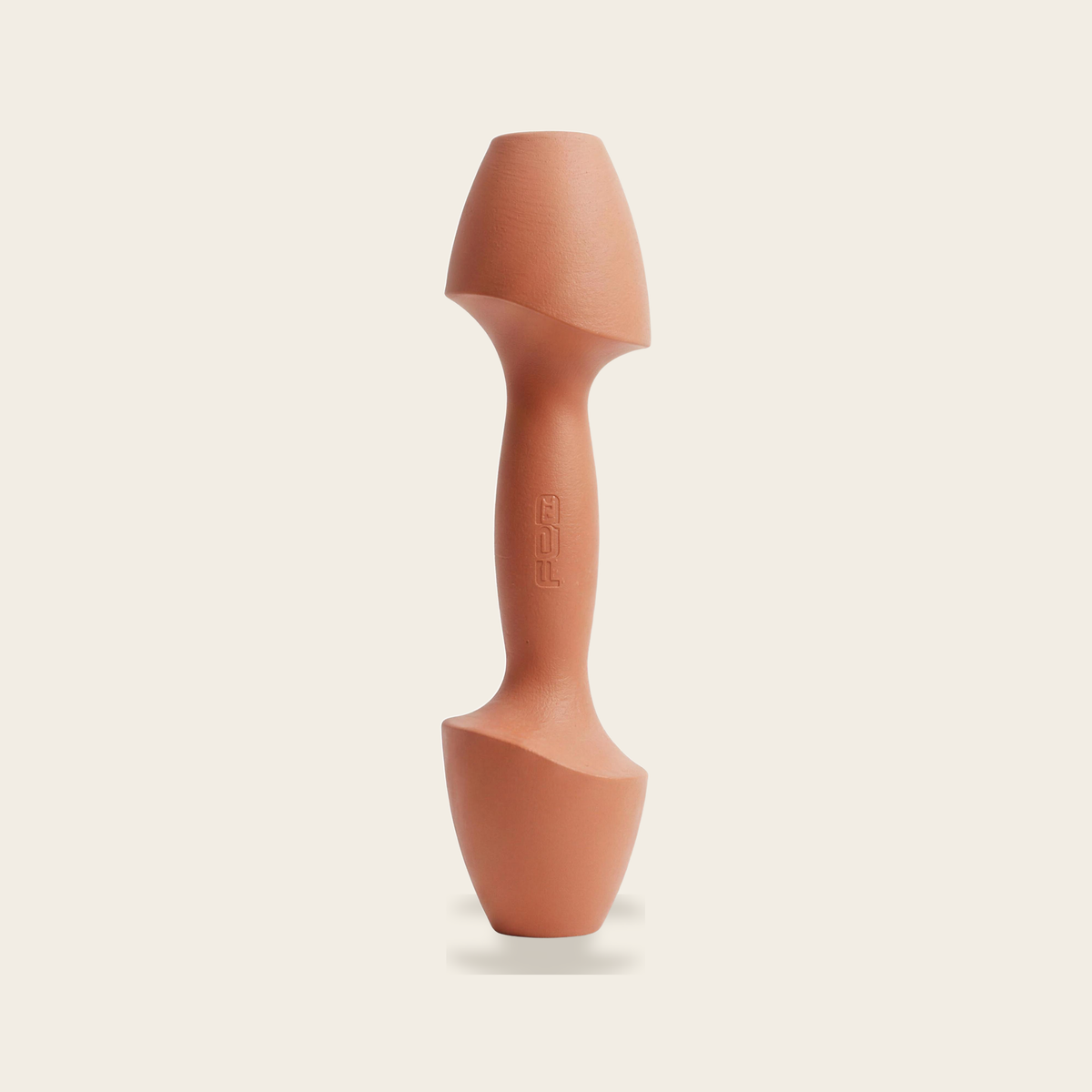 The Sculpt Dumbbell in orange on a cream background