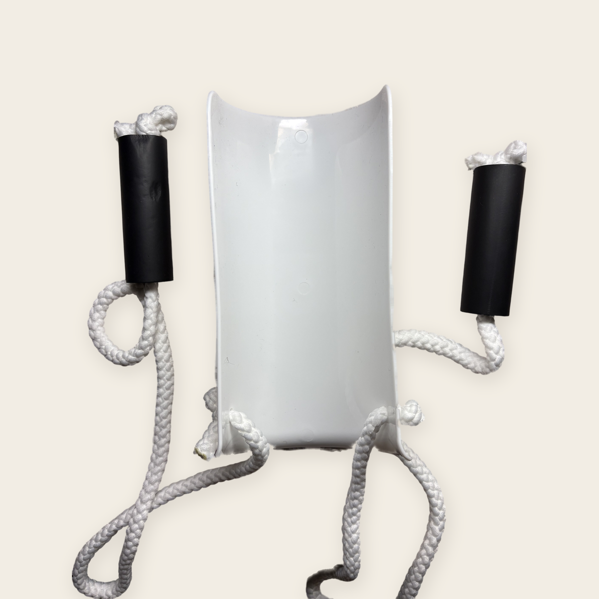 Inside of the Sock Aid's curved plastic shell, where the sock goes, with a foam handle and cord on each side