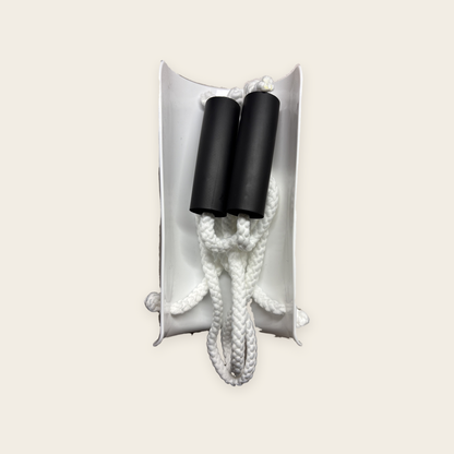 The Sock Aid packed away, with both foam handles and cords tucked inside the shell