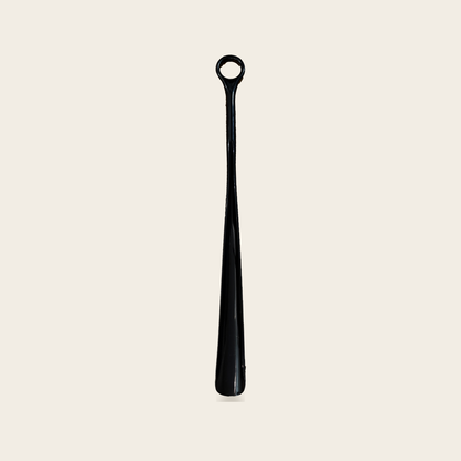 Long reach shoe horn in black on a cream background