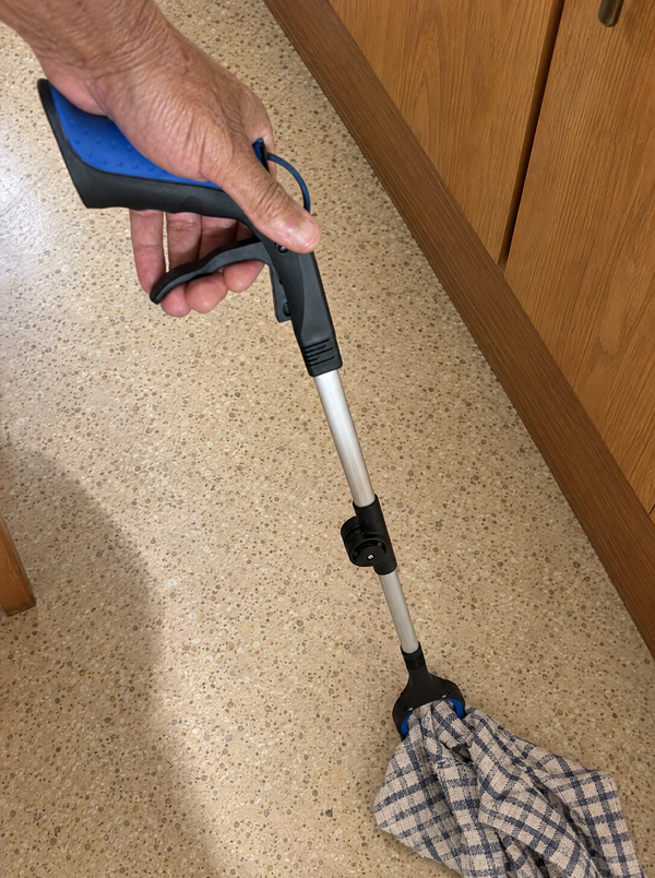 Picking a tea towel up off the kitchen floor with the grabber