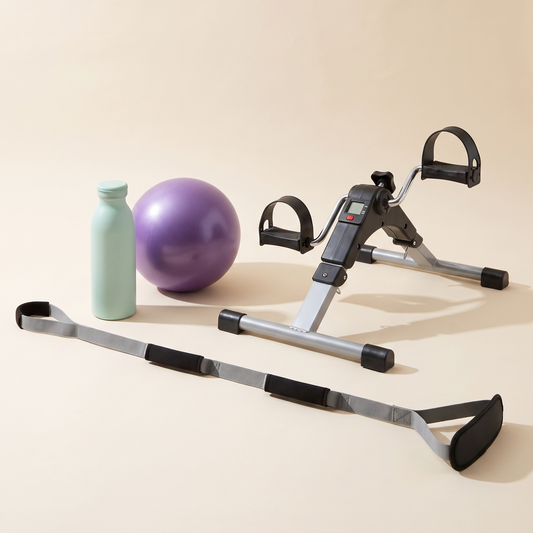 Knee Replacement Ready Kit on a cream background: mini pedal exerciser, purple mini exercise ball, mint green water bottle and triple grip leg lifter strap.