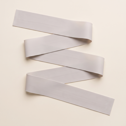 The kit's Long Resistance Band laid out flat in full, a long flat band rather than a loop.