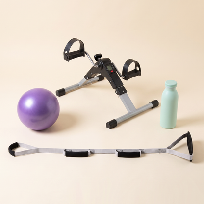 Knee Replacement Ready Kit on a cream background: mini pedal exerciser, purple mini exercise ball, mint green water bottle and a triple grip leg lifter strap.